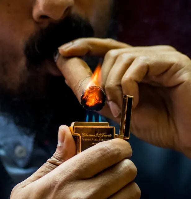 Man Lighting a Cigar