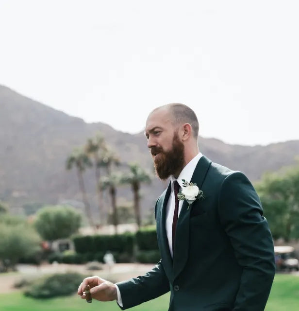 Groom on his wedding day enjoying a cigar